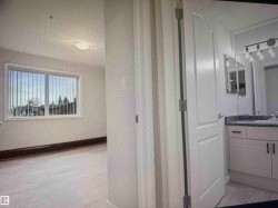 Bathroom vanity with dual sinks, wall-mounted mirror cabinets, and a multi-bulb light fixture - 