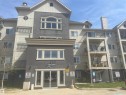Exterior facade featuring stucco and siding finishes - #106 592 Hooke Rd Nw, Edmonton, AB  - Outdoor With Facade 
