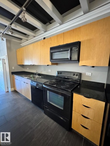 #304 10179 105 St Nw, Edmonton, AB - Indoor Photo Showing Kitchen With Double Sink