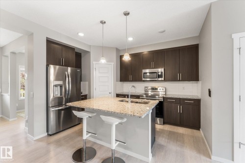 457 Orchards Boulevard Sw, Edmonton, AB - Indoor Photo Showing Kitchen With Double Sink With Upgraded Kitchen