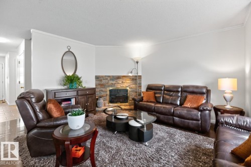 #23 3520 60 St Nw, Edmonton, AB - Indoor Photo Showing Living Room With Fireplace