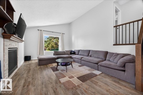 39 Mcnabb Crescent, Stony Plain, AB - Indoor Photo Showing Living Room With Fireplace
