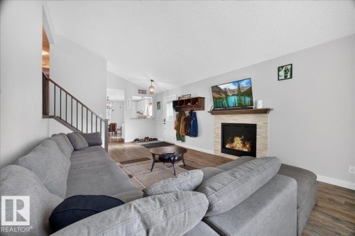 39 Mcnabb Crescent, Stony Plain, AB - Indoor Photo Showing Living Room With Fireplace