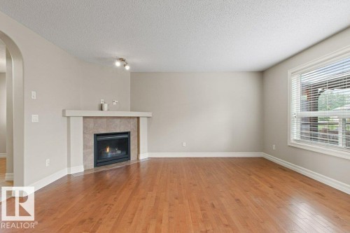 1636 Westerra Avenue, Stony Plain, AB - Indoor Photo Showing Other Room With Fireplace