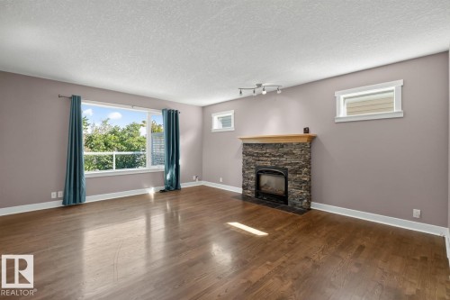 18 Cascade Crescent, Sherwood Park, AB - Indoor Photo Showing Living Room With Fireplace