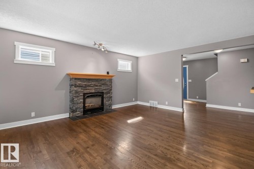 18 Cascade Crescent, Sherwood Park, AB - Indoor Photo Showing Living Room With Fireplace
