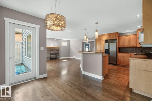 18 Cascade Crescent, Sherwood Park, AB - Indoor Photo Showing Kitchen With Fireplace