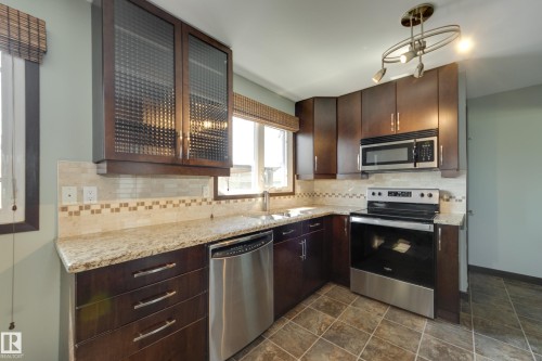 8003 136 Avenue Nw, Edmonton, AB - Indoor Photo Showing Kitchen With Double Sink