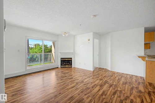 #203 8119 112 Av Nw, Edmonton, AB - Indoor With Fireplace