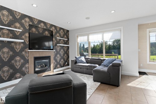 5811 Mullen Place Nw, Edmonton, AB - Indoor Photo Showing Living Room With Fireplace