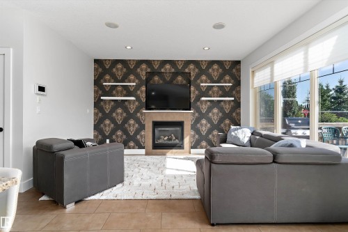 5811 Mullen Place Nw, Edmonton, AB - Indoor Photo Showing Living Room With Fireplace