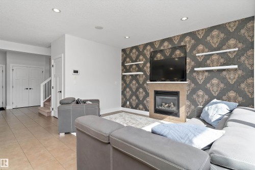 5811 Mullen Place Nw, Edmonton, AB - Indoor Photo Showing Living Room With Fireplace
