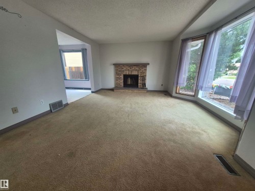 3801 33 Avenue, Leduc, AB - Indoor Photo Showing Living Room With Fireplace