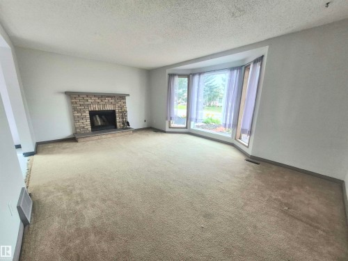 3801 33 Avenue, Leduc, AB - Indoor Photo Showing Other Room With Fireplace