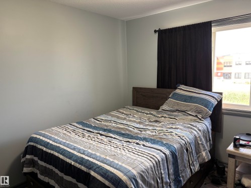 #18 4900 62 St, Beaumont, AB - Indoor Photo Showing Bedroom