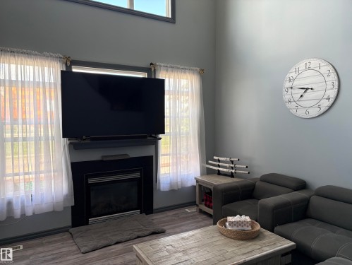 #18 4900 62 St, Beaumont, AB - Indoor Photo Showing Living Room With Fireplace