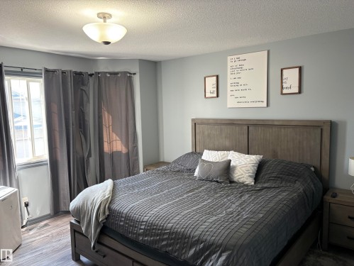 #18 4900 62 St, Beaumont, AB - Indoor Photo Showing Bedroom
