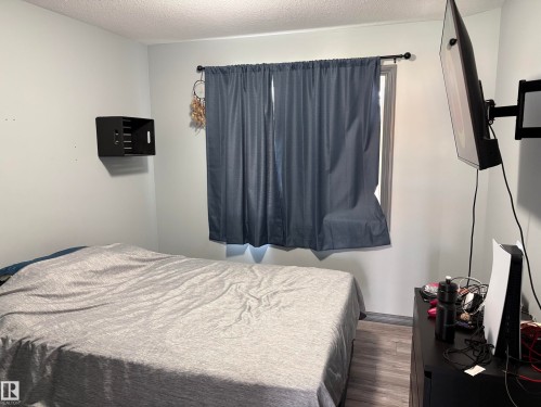 #18 4900 62 St, Beaumont, AB - Indoor Photo Showing Bedroom