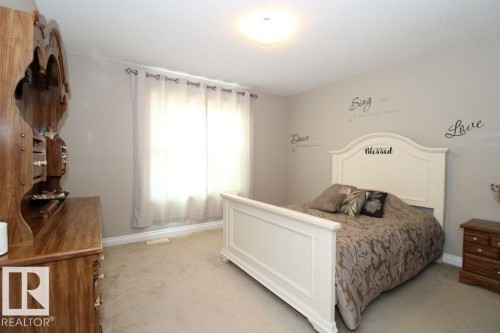 Neutral-toned room featuring light-colored carpeting and a window with light-filtering curtains - 3048 Harvey Crescent Nw, Edmonton, AB - Indoor Photo Showing Bedroom