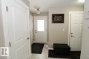 Entryway featuring light neutral wall paint and a semi-flush mount ceiling light - 3048 Harvey Crescent Nw, Edmonton, AB  - Indoor Photo Showing Other Room 