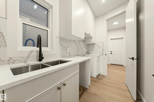 4276 Charles Close Sw, Edmonton, AB - Indoor Photo Showing Kitchen With Double Sink