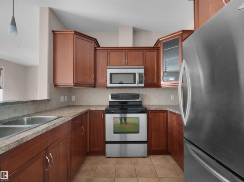 #241 2503 Hanna Cres Nw, Edmonton, AB - Indoor Photo Showing Kitchen With Double Sink