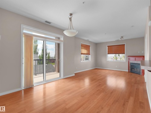 #241 2503 Hanna Cres Nw, Edmonton, AB - Indoor With Fireplace