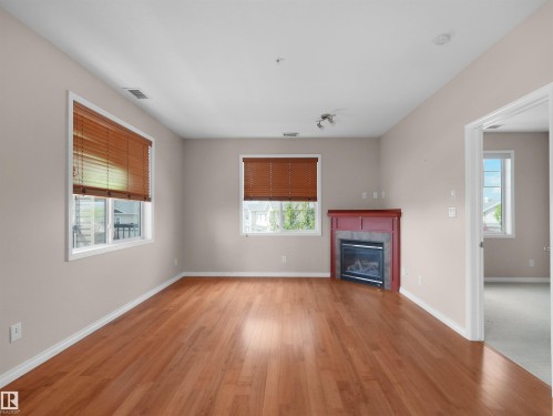 #241 2503 Hanna Cres Nw, Edmonton, AB - Indoor With Fireplace