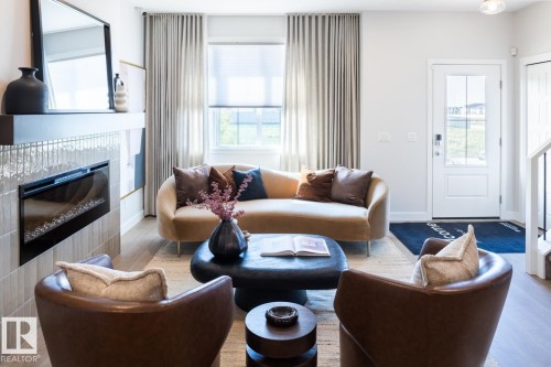 216 Chappelle Drive Sw, Edmonton, AB - Indoor Photo Showing Living Room With Fireplace