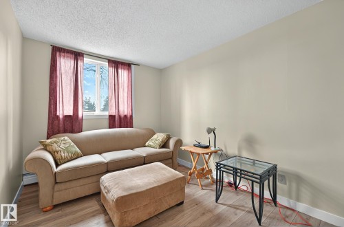 #106 5125 Riverbend Rd Nw, Edmonton, AB - Indoor Photo Showing Living Room