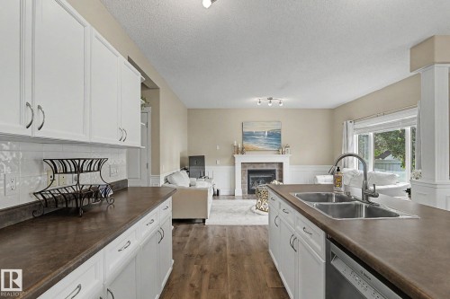 5632 201 St Nw, Edmonton, AB - Indoor Photo Showing Kitchen With Fireplace With Double Sink