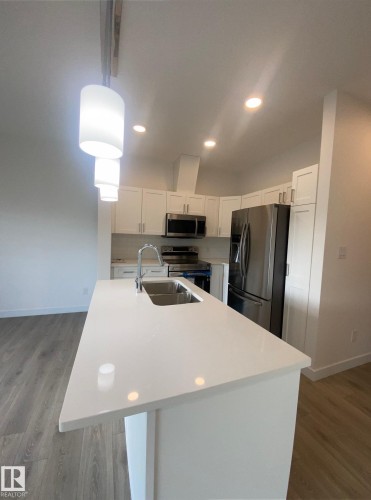 #21 603 Orchards Bv Sw, Edmonton, AB - Indoor Photo Showing Kitchen With Double Sink