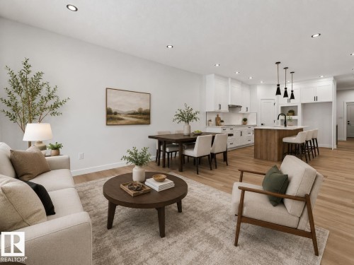 Open-concept living space featuring light wood-finish flooring, recessed ceiling lighting, and a neutral color palette - 3318 Chickadee Drive Nw, Edmonton, AB - Indoor Photo Showing Living Room