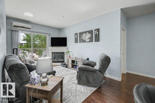 #204 5 Perron St, St. Albert, AB - Indoor Photo Showing Other Room With Fireplace