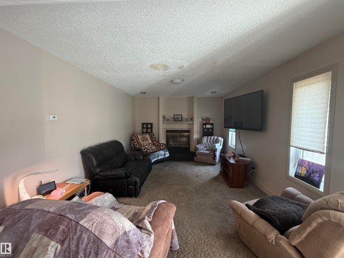 1 Adamic Crescent, Leduc, AB - Indoor Photo Showing Living Room With Fireplace