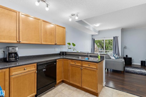#507 164 Bridgeport Bv, Leduc, AB - Indoor Photo Showing Kitchen With Double Sink