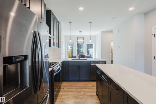 1665 Plum Circle Circle Sw, Edmonton, AB - Indoor Photo Showing Kitchen With Stainless Steel Kitchen With Upgraded Kitchen