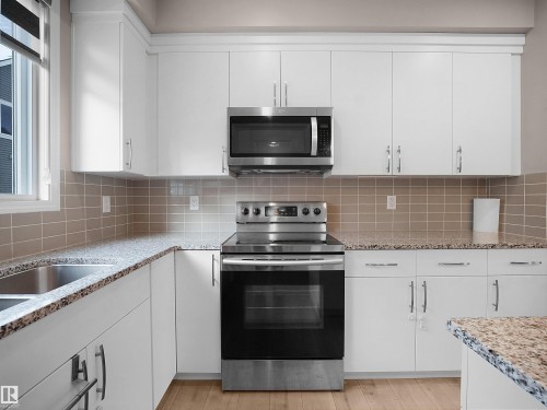 2080 Wonnacott Way Sw, Edmonton, AB - Indoor Photo Showing Kitchen With Upgraded Kitchen