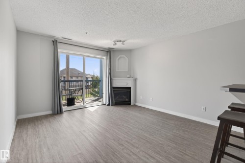 #319 16303 95 St Nw, Edmonton, AB - Indoor Photo Showing Living Room With Fireplace