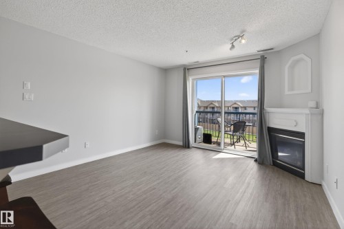 #319 16303 95 St Nw, Edmonton, AB - Indoor With Fireplace
