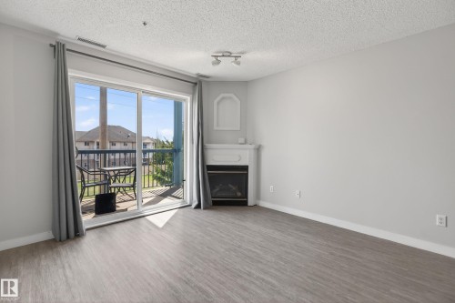 #319 16303 95 St Nw, Edmonton, AB - Indoor Photo Showing Living Room With Fireplace