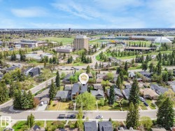 Aerial perspective showcasing a residential street with mature trees - 