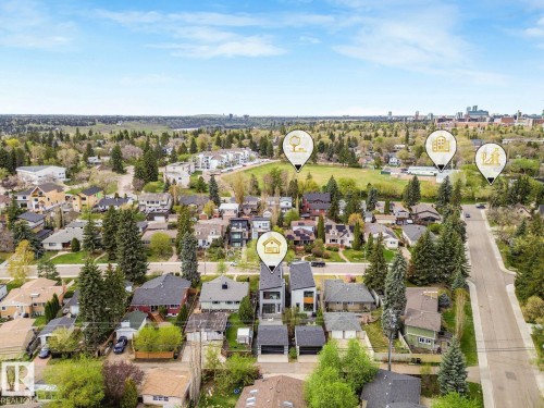 Aerial perspective showcasing a residential neighborhood with varied architectural styles - 11613 72 Avenue Nw, Edmonton, AB - Outdoor With View