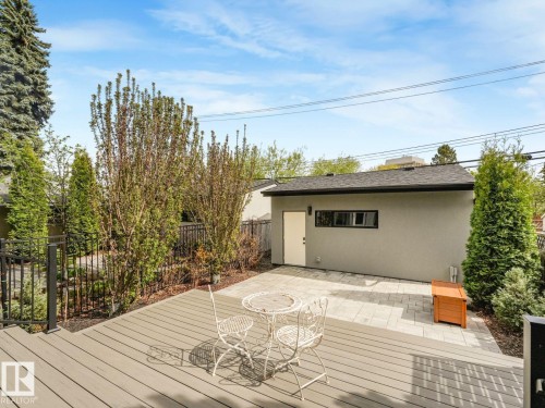 Spacious outdoor deck with composite decking and black metal railings - 11613 72 Avenue Nw, Edmonton, AB - Outdoor