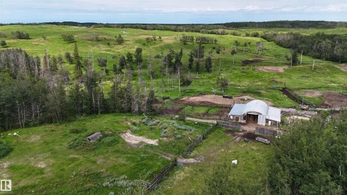 Expansive green landscape featuring a functional barn structure - 11218 Twp Rd 590, Rural St. Paul County, AB - Outdoor With View