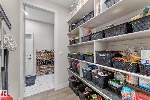 Spacious pantry featuring extensive built-in shelving, providing ample storage capacity - 12383 176 Avenue Nw, Edmonton, AB - Indoor