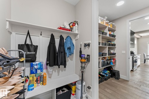 Entryway mudroom featuring built-in storage bench, upper shelving, and coat hooks - 12383 176 Avenue Nw, Edmonton, AB - Indoor Photo Showing Other Room