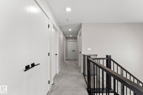 Upper-level hallway with neutral wall tones and recessed lighting - 12383 176 Avenue Nw, Edmonton, AB - Indoor Photo Showing Other Room