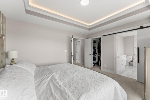 Recessed tray ceiling with integrated lighting - 12383 176 Avenue Nw, Edmonton, AB - Indoor Photo Showing Bedroom