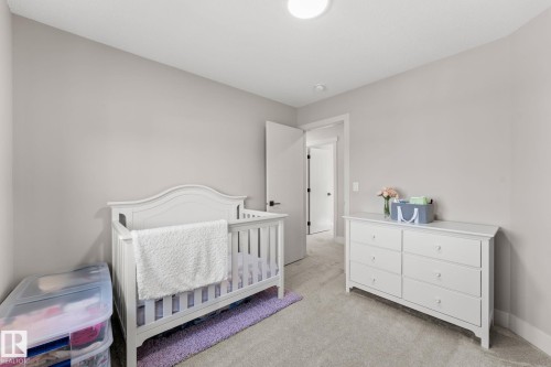Neutral-toned room featuring light gray walls and plush gray carpeting - 12383 176 Avenue Nw, Edmonton, AB - Indoor Photo Showing Bedroom